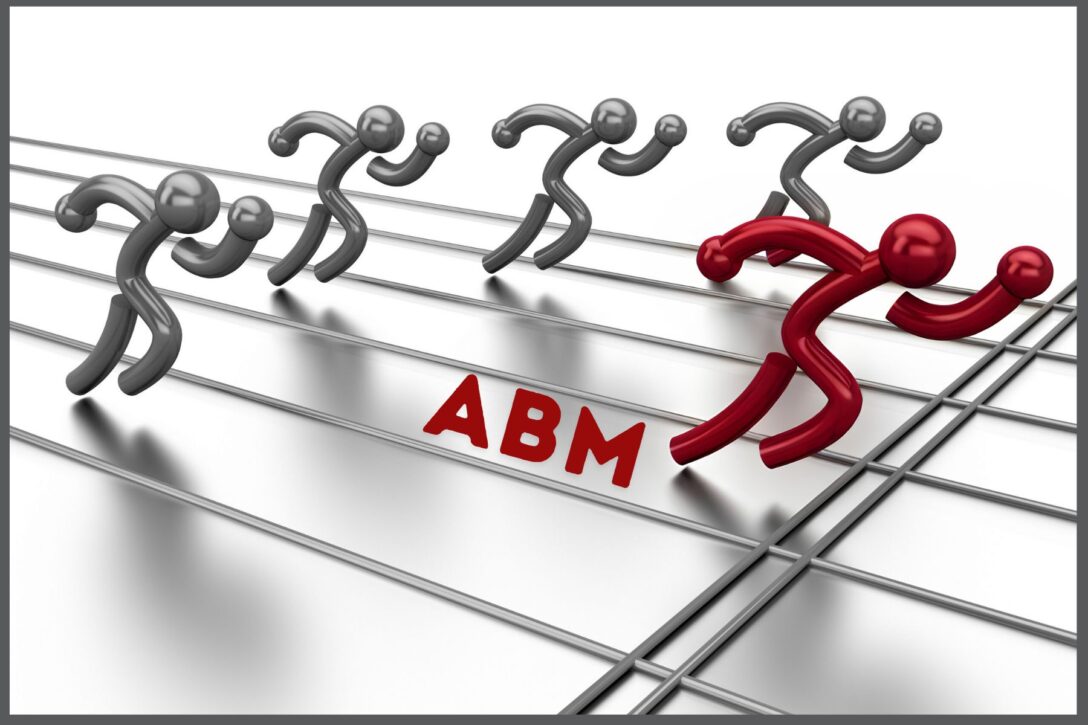 red figure winning a race on a race track with the label ABM in their lane